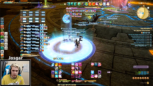 People at a concert facing the stage with various colours of paint powder in the air